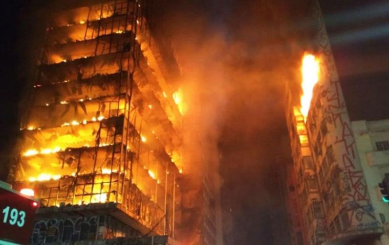 Firefighters work to extinguish the fire in a 24-storey building used by squatters that later collapsed in Sao Paulo, Brazil, the largest city in Latin America