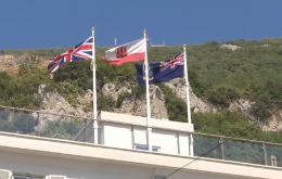 The Falklands flag flying next to the Union Jack and Gibraltar's colors 