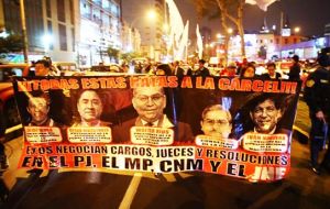 Over 5,000 demonstrators marched through the streets of Peru's capital Lima on Thursday night waving flags and chanting, “Judicial power, national shame!”