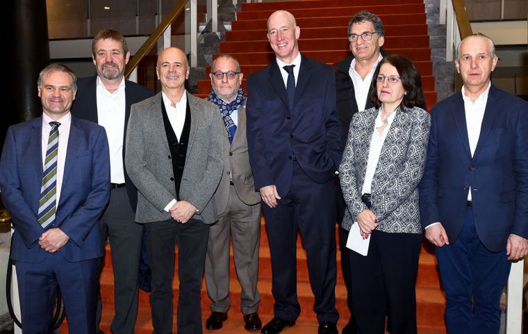 Minister Faurie and ambassador Kent (C) next to other Argentine officials at the San Martin theatre