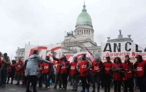 The rally was organized by labor unions and includes teachers and other workers protesting a budget that includes tax hikes, government cuts and austerity measures