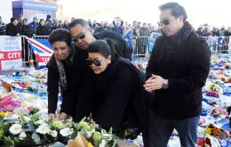 The Thai businessman's wife Aimon and son Aiyawatt laid a wreath in the centre circle and then hugged and shook hands with the players and coaching staff