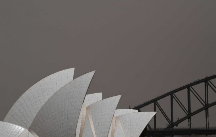 The impact of the dust was obvious across iconic locations like the Opera House, Sydney Harbour Bridge and Bondi Beach