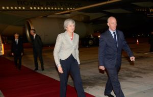 Prime Minister Theresa May escored with British Ambassador in Argentina Mark Kent