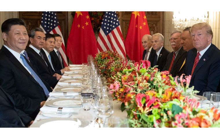 Xi Jinping and Donald Trump sit beside fellow members of the Chinese and U.S. delegations at Saturday night’s working dinner in Buenos Aires.