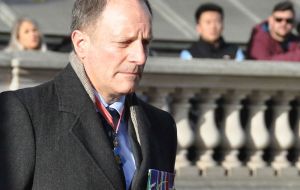 Brigadier William Aldridge goes forward to lay the wreath for Britain's Armed Forces