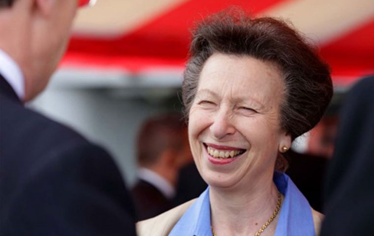 HRH Princess Anne smiles as she talks to guests on HMS Montrose.