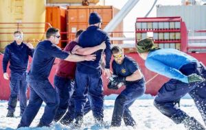 Members of HMS Protector's Ship's Company enjoying a game of Rugby on The Strange Ice Shelf in Antarctica. 