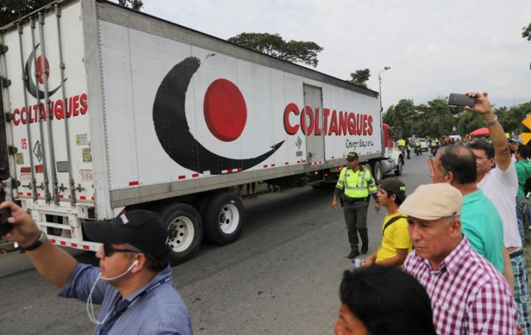 Escorted by police motorcycles, the trucks pulled into Cucuta, where Venezuelans were waiting to see whether Maduro’s government would clear the border road 