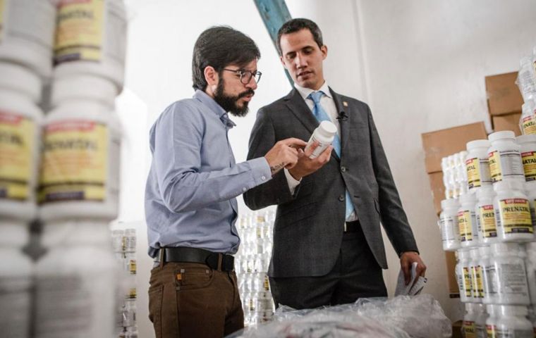 Guaido tweeted a photo of himself surrounded by stacks of white pots of vitamin and nutritional supplements. He did not say from where or whom they came.
