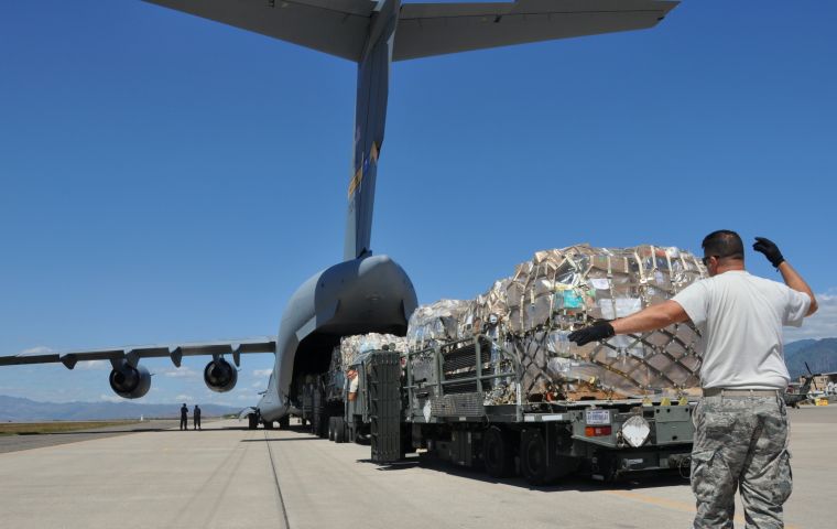 The aircrafts transport boxes sealed with the label of the United States Agency for International Development (USAID), contain food and assistance for about 25 thousand people