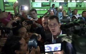 Supporters, media, and diplomats from allied countries mobbed Guaido on his arrival at the international airport in Caracas before he headed into the city