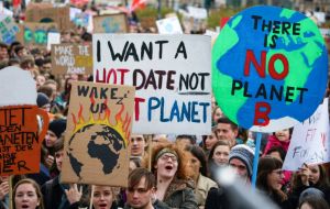 Across the world placards inspired: “Like the ocean, we will rise”; “Our future in your hands”; “System Change not Climate Change”; “Don't be a Trump”