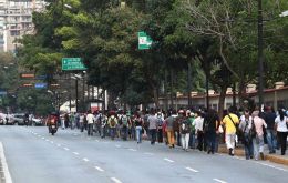 Power had returned to many parts of Caracas by noon on Tuesday, but businesses remained idle and few pedestrians were walking the streets