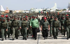 Venezuela's armed forces are strained under the country's myriad crises, leading many to defect. But they have remained cohesive and its leadership loyal to Maduro