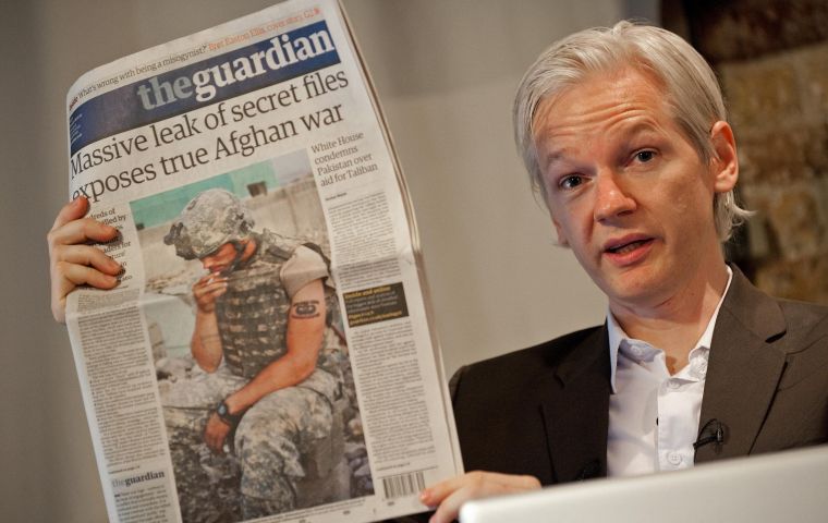 Assange gave a thumbs up in handcuffs as he was taken from a police station to a London court, where he declared himself not guilty of failing to surrender in 2012