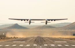 With a dual fuselage design and wingspan greater than the length of an American football field, the Stratolaunch aircraft took flight from the Mojave Air Base