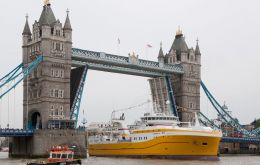 Decked out in bunting and naval flags, the 81-metre, 4,000 ton Kirkella arrived at Greenwich, steaming under a raised Tower Bridge