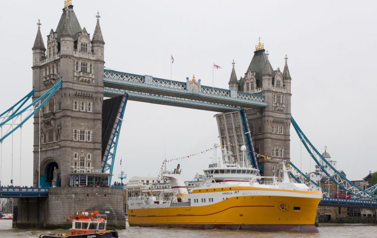 Decked out in bunting and naval flags, the 81-metre, 4,000 ton Kirkella arrived at Greenwich, steaming under a raised Tower Bridge