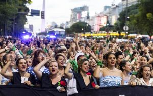 Argentine women march in Buenos Aires dressed as Evita Peron to honor her memory and achievements  