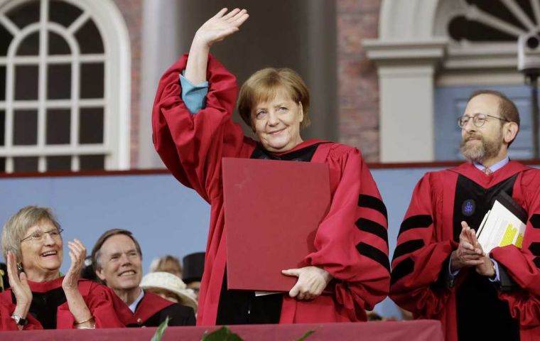  “We can and must do everything humanly possible to truly master this challenge to humankind,” said Merkel at Harvard university