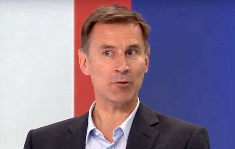  Hunt said he spoke with Merkel at this week's D-Day commemorations and was convinced changing May's agreement was possible