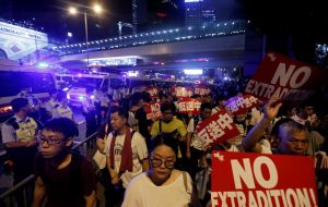 Demonstrators hurled bottles and used metal barricades as police moved in moments after the protest permit expired.