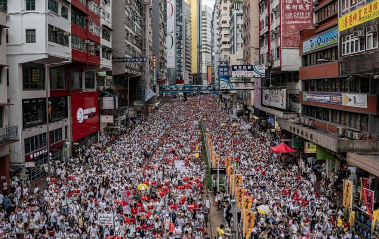 What began as a largely peaceful rally outside the Legislative Council turned chaotic as tens of thousands of protesters charged at the police