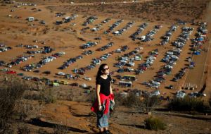 Tens of thousands of tourists and locals gaped skyward Tuesday as a rare total eclipse of the sun began to darken the heavens over northern Chile.