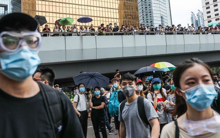 The protests sweeping the former colony have also revived tensions inherent in the two sides' historic agreement on the financial hub's handover to China in 1997