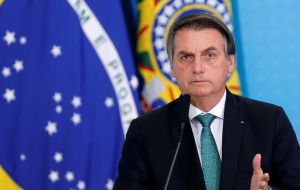 Bolsonaro says the indigenous territories are too big given the number of people living there; critics accuse him of encouraging illegal mining and reserves invasions