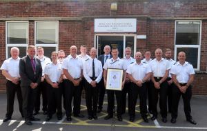 Vice Admiral Kyd presents his commendation to the rescue team in Gosport