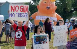 Protesters gathered, just as they had at Trump's earlier stop in Dayton, Ohio, where nine people died in a separate mass shooting over the weekend.