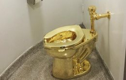 The toilet, valued at more than US$5 million, was part of an exhibition of work by Italian conceptual artist Maurizio Cattelan. 