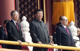 Xi, dressed in a slate grey “Mao” suit and accompanied by his predecessors Hu Jintao and Jiang Zemin, said China would pursue a mutually beneficial strategy of opening up
