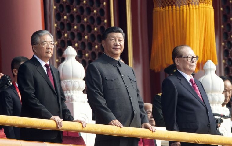 Xi, dressed in a slate grey “Mao” suit and accompanied by his predecessors Hu Jintao and Jiang Zemin, said China would pursue a mutually beneficial strategy of opening up