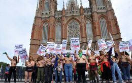 Shirtless women, calling the protest a “tetazo,” or “boob-protest”, shouted slogans: “Abort your heterosexuality,” “’death to the macho’ is not a metaphor.”