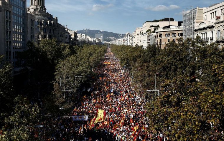 Some 120.000 people marched down Barcelona's central Gracia thoroughfare with  Spanish and Catalan flags and chanting “that's enough; streets belong to everyone”