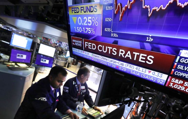 The Federal Reserve lowered the target for its benchmark rate by a quarter point, to a range of 1.5% to 1.75%