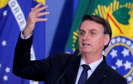 Bolsonaro plans to accompany Economy Minister Guedes on a visit to Congress, hoping to defy the backlash against belt-tightening policies in Latin America
