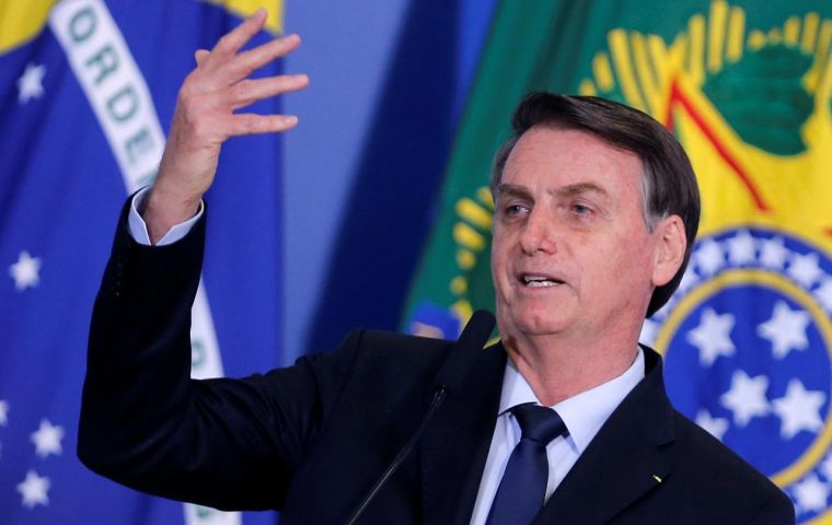 Bolsonaro plans to accompany Economy Minister Guedes on a visit to Congress, hoping to defy the backlash against belt-tightening policies in Latin America