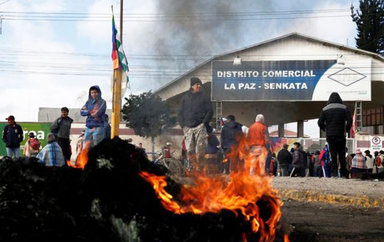 Helicopters flew above roads around the Senkata gas plant, operated by state-run YPFB, which were blocked with piles of burning tires (Pic Reuters)