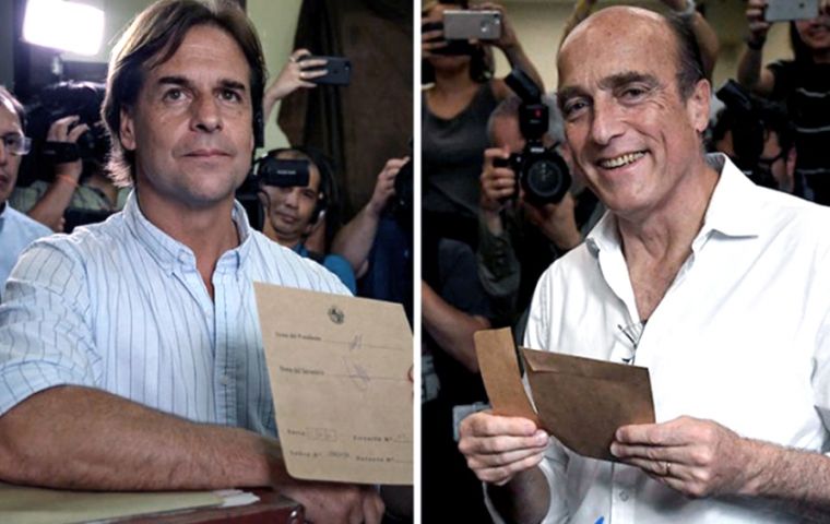Luis Lacalle Pou (left), who opinion polls anticipates up to 8% advantage over his rival for Sunday's runoff: Daniel Martinez (right), the incumbent and dullest candidate of  leftist Broad Front