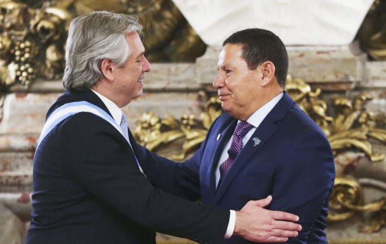 Brazilian vice president ex General Hamilton Mourao attended the swearing in ceremony of Alberto Fernandez and warmly embraced the president. (Pic AP)
