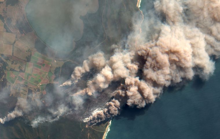 Some 100 fires have been burning for weeks in NSW, half of those uncontained, including a “mega-blaze” ringing Sydney, covered in a haze of toxic smoke