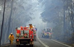 Authorities asked people to delay travel, at the start of what is normally a busy Christmas holiday period, warning of the unpredictability of the fires 