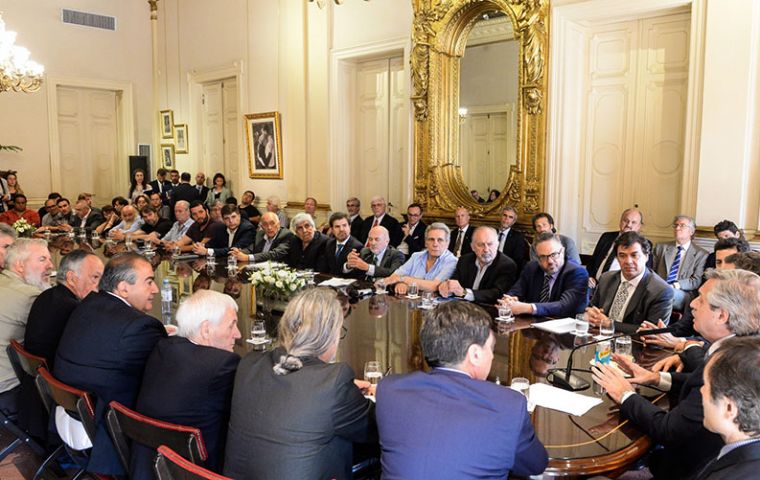 President Alberto Fernandez with ministers and representatives from different organizations and unions during discussion at Government House 
