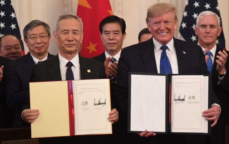 Donald Trump and Vice Premier Liu He on Wednesday signed a deal that will roll back some tariffs and see China boost purchases of U.S. goods and services