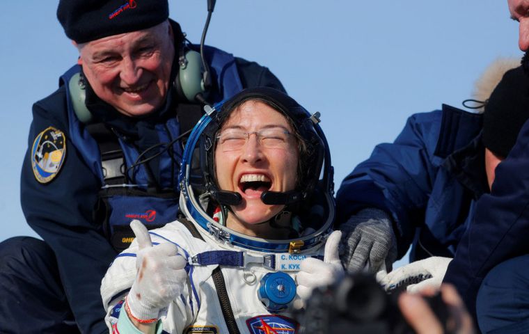 Koch was shown seated and smiling broadly after being extracted from the Soyuz descent module in the Roscosmos space agency's video footage