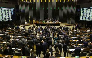 In a year of local elections, lawmakers are worried about voter rejection over austerity measures and overturned Bolsonaro's veto by 303 votes against 137.